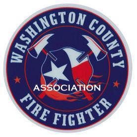 Logo of the Washington County Fire Fighter Association. The logo features a circular design with red borders, a blue and white star in the center, two crossed fire axes, and flames at the bottom. The words "Washington County Fire Fighter Association" encircle the design.