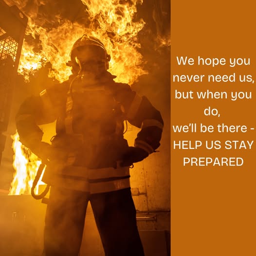 A firefighter stands confidently in full gear with a blazing fire behind them. The text reads: "We hope you never need us, but when you do, we'll be there - HELP US STAY PREPARED.